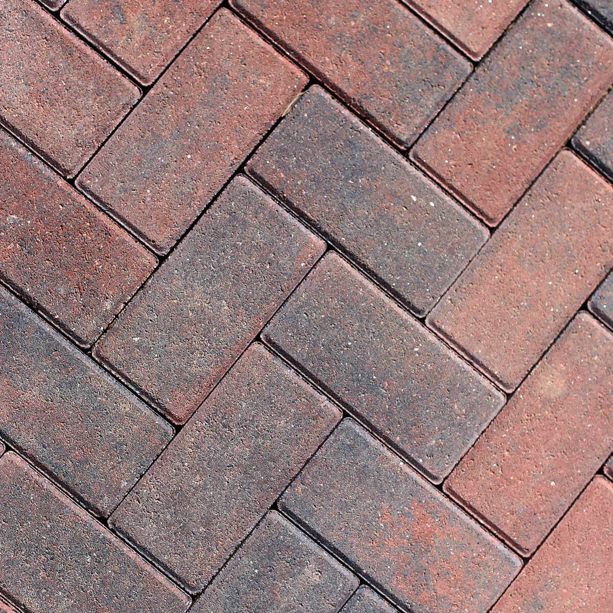 Red and charcoal block paving showing the finished surface detail